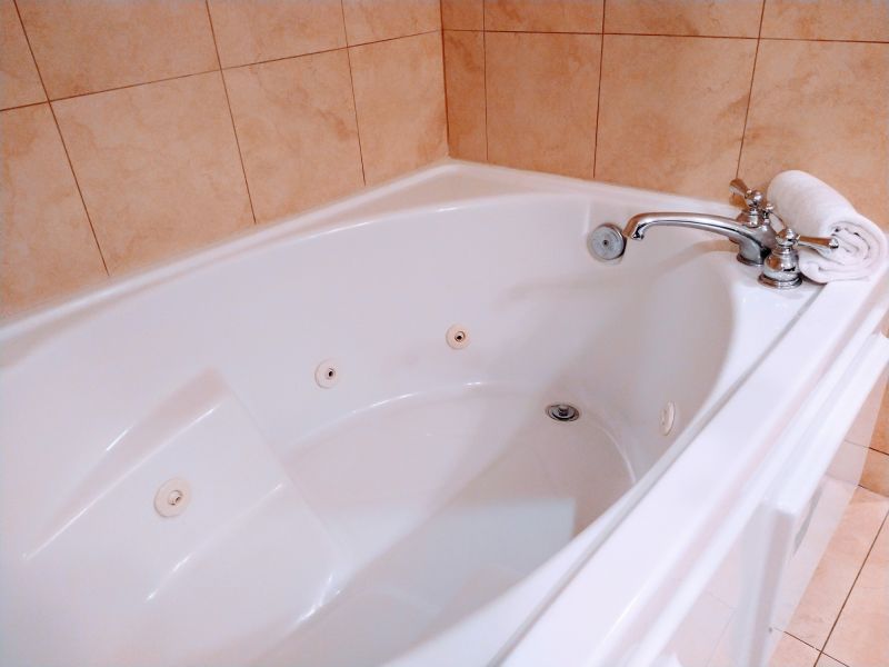 Finished bathtub with polished fixtures